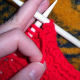 Purl the next stitch.