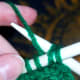 Yarn over the working needle.