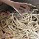 The drained pasta tossed with the pesto.