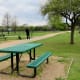 Picnic tables outside of fenced areas in the Millie Bush Bark Park