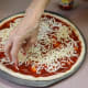 Use your hands to distribute the cheese.