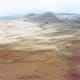 Barren looking land below as we approach the volcano.