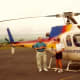 Stopping in Hilo to refuel the helicopter. My husband is talking to the pilot in this photo.
