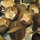 Roasted Chestnuts. They will open up like this. Take off the outer and inner husks. If you have trouble getting the inner husks out, put them back in the oven for another 15 minutes.