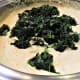 Adding the spinach to the mixture