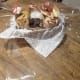 Cut a generous piece of cellophane wrap and place the paper bag base in the middle. Make sure the cellophane is at least 8–10 inches on each side.