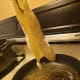 let excess oil drip off