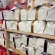 The bread is wrapped in a beautiful wrapping paper, perfect for a holiday gift.