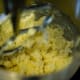 Add in sugar with extracts and combine until mixed.