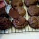 Spoon the melted chocolate on top of each cookie.