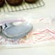 While cookies are cooling, place candy canes in a gallon sized freezer bag and fold in half. Use a heavy spoon to break up the candy cane into pieces.