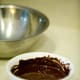 Set aside 2/3 cup of melted chocolate chips to be used for the top of the cookies.