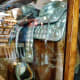 Mounted silver saddle behind the glass enclosure.