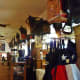 Food service counter on the left with booths on the right. Notice the saddles above.