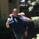 Anchoring his elbow on the attacker's back, defender pulls down on attacker chin, forcing his head backwards