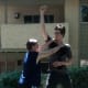 Defender raises his right arm straight up