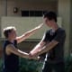 Attacker grabs A's right wrist with both of his hands and A strikes the attacker's eyes with left handed finger strike