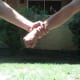 Defender turns his hand and wrist to a horizontal position, narrowing the gap between his attacker's fingers and thumb, providing a space to escape.