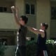Defender raises both hands up