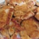 A plate of browned chicken thighs