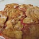 Layer the browned chicken thighs over the tomato sauce