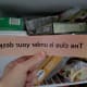 Wear gloves, cold clue—it has to be in the freezer. Sure enough! But how am I supposed to read this?!