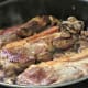 Add in the ribs and mushrooms.