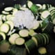 Slice the zucchini, chop the onion, and place them in a stovetop pan