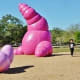 Another view of the sculptures and people