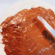 Use a spatula or a spoon to spread 3 tablespoons of Nutella across the dough, leaving 1/4-inch border of bare dough.