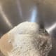 In a stand mixer bowl fitted with a dough hook, combine the bread flour, all-purpose flour, milk powder, sugar, yeast, and salt.