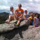 Family at the top of the rocks that border Sylvan Lake.