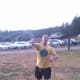 Our son Michael tries his hand at a lasso—another Circle B Chuckwagon activity.