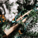 Tuck it into the branches.