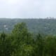 View of Eureka Springs from atop Magnetic Mountain (home of Christ of the Ozarks); the Crescent Hotel is visible on the horizon.