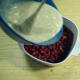 Pour flour mixture over raspberries.