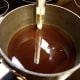 Put pure maple syrup in saucepan with a candy thermometer. Prepare ice in heat resistant bowl (I used a pie plate).