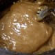 Remove pan from heat and put on ice until it cools to 125 degrees (don't stir). When mixture is cooled to 125, use a fork or spoon to start mixing it vigorously until mixture is lighter and opaque. This takes about 10-15 minutes.