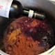 Add wine to the pot