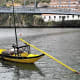 Flat bottomed boat near Ponte de Dom Luis 1, Porto.
