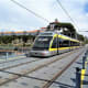 Trams share the upper level of Ponte de Dom Luis 1 with pedestrians.