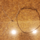 Shape one wire hanger into an X and the other into an O.