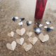 Cut heart shapes from your old book pages and colored paper. I made 8 hearts from each.
