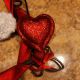 Secure hearts to frame using a piece of floral wire.