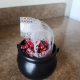 Arrange your beads and ribbon in your cauldron or container.