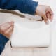 Roll the dough to a rectangle. Bring two short ends of the dough to meet in the center. Then, fold the dough in half at the point where they meet.