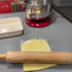Press it down with a rolling pin to form a thin sheet.