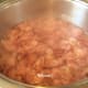 Simmering rose petals mixture.