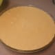 Pour the mixture into the greased pie dish.