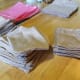 Finished and unfinished cloth toilet paper squares.